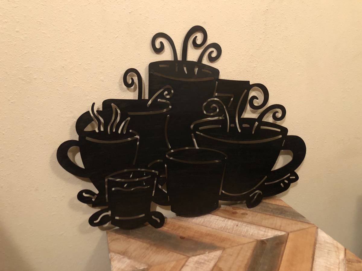 https://creativebargains.com/wp/wp-content/uploads/2021/03/Large-Black-Metal-Art-Steaming-Coffee-Cups-Wall-Hanging.jpg